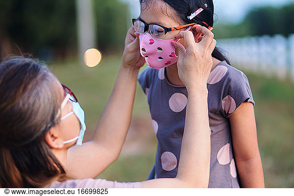 Mother wore a mask for daughter when going out during COVID 19