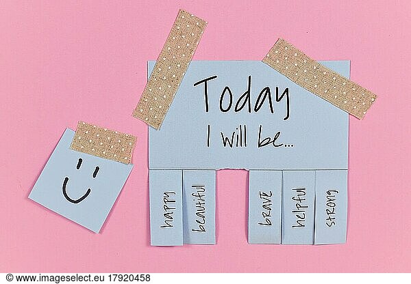 Motivational concept with blue tear-off stub note with text Today I will be. . and words happy  beautiful  brave  helpful and strong on pink background