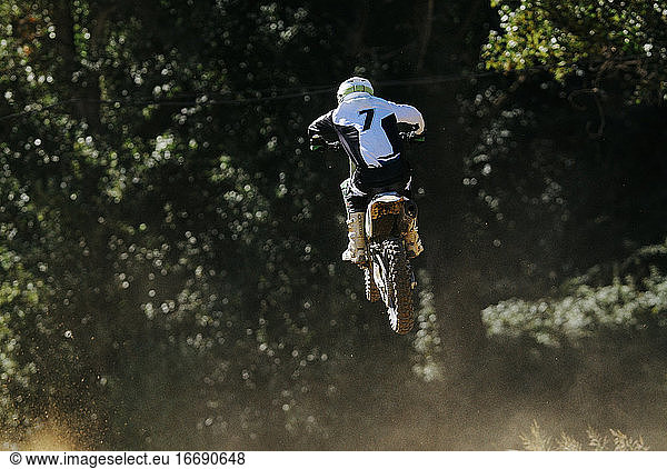 Motocross number 7 jumping with dust