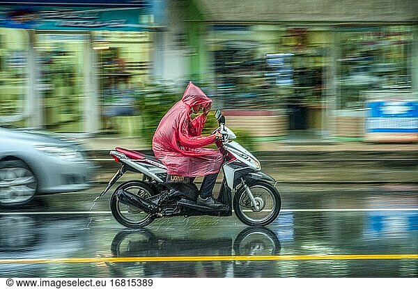 Motor scooter on rainy afternoon in Phang-nga  Thailand.