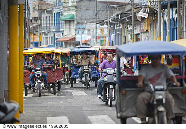 Motor taxi traffic in downtown Iquitos  Peru