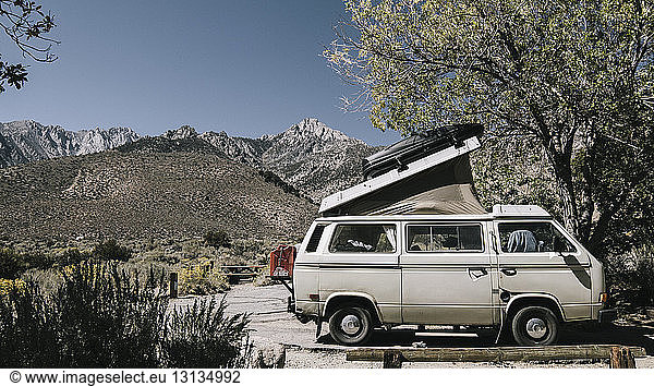 Motorhome against mountains during sunny day