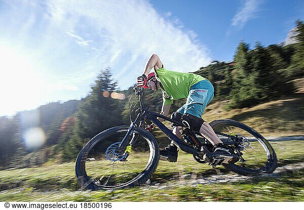 Mountain biker riding on track  Tirol  Austria