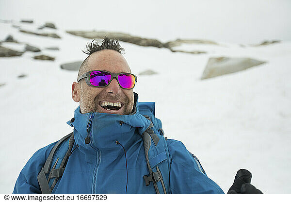 Mountain climber  Adam Palmer  laughing outdoors.