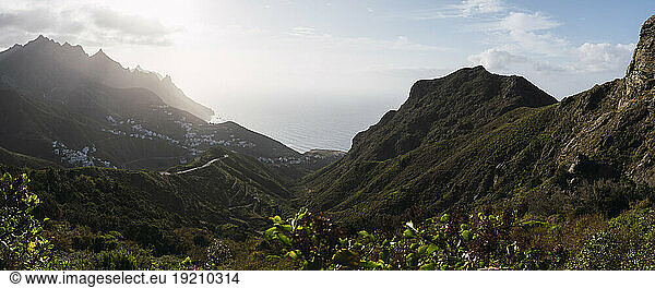 Mountain ranges under sky at sunny day