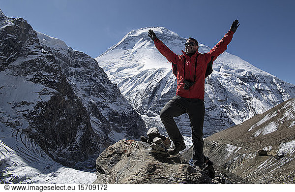 Mountaineer cheering on top of French Pass  Dhaulagiri Circuit Trek  Himalaya  Nepal