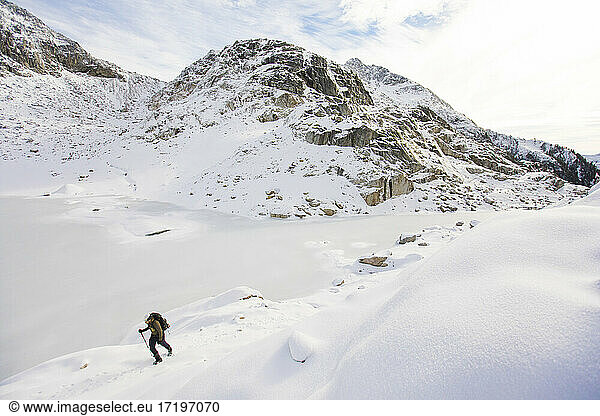 Mountaineer hikes across snow in the coast mountain range  Squamish.