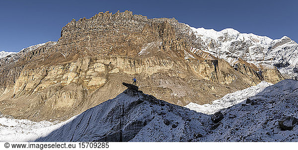 Mountaineer on top of a rock  Dhaulagiri Circuit Trek  Himalaya  Nepal