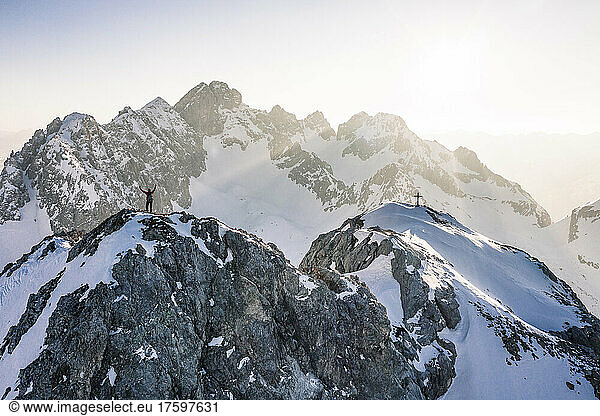 Mountaineer standing on top of Vorderer Tajakopf mountain  Ehrwald  Tirol  Austria