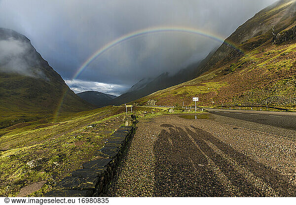 Mountains in Scotland with a rainbow