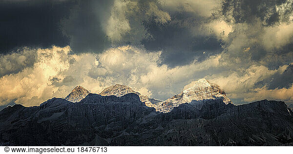 Mountains under cloudy sky at sunrise  Dolomites  Italy