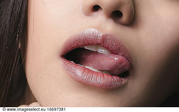 Mouth closeup Juicy lips macro shot.
