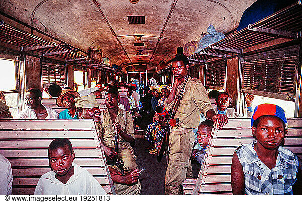 Mozambique  civil war: Two years after independence  the civil war between the Frente de Libertação de Moçambique (FRELIMO) and the Resistência Nacional Moçambicana (RENAMO) begins in 1977 with thousands of victims. Railway train running from Beira to Nhamatanda and on to Zimbabwe through what is known as the Beira Corridor . The Beira Corridor is a road and rail link between the coast of Mozambique and Zimbabwe and other landlocked African countries  which is protected by Zimbabwean troops during the civil war. Here: passengers on the train. Soldiers assigned to protect the train from rebel attacks.
Beira  1990.
