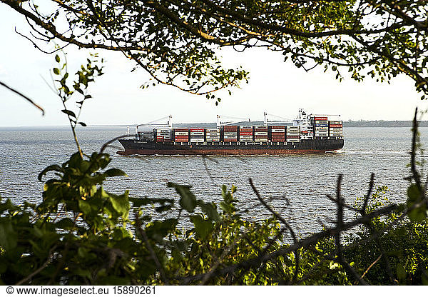 Mozambique  Maputo  Fully loaded container ship sailing across Maputo Bay