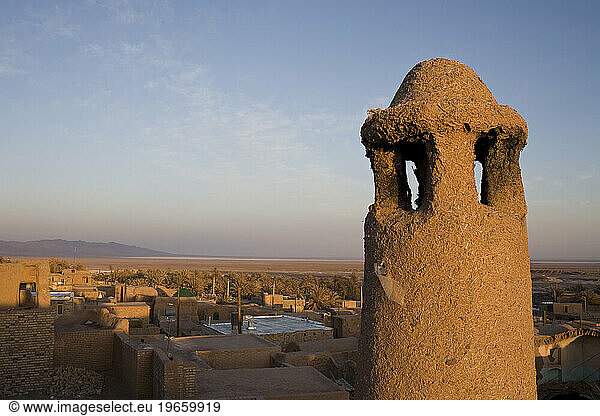 Mud chimney in desert oasis town of Garmeh  Iran.