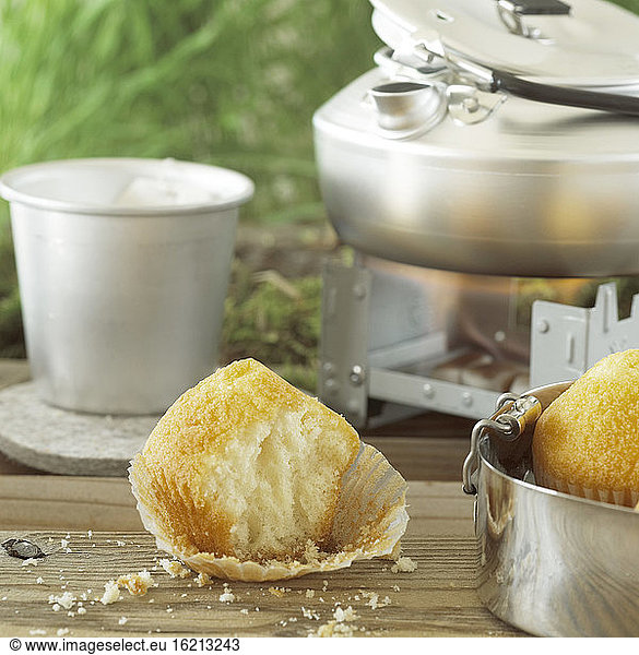 Muffin with mug of tea  close-up
