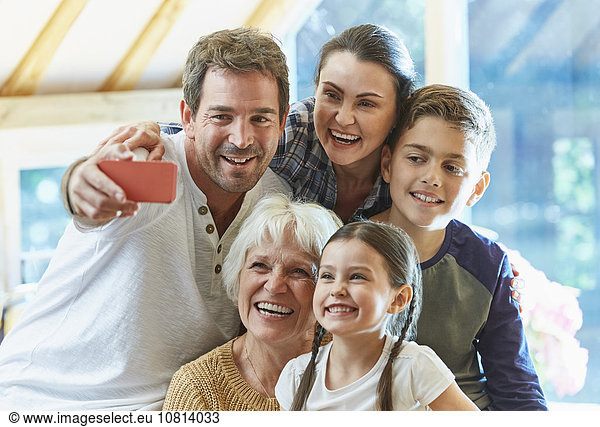 Multi-generation family taking selfie