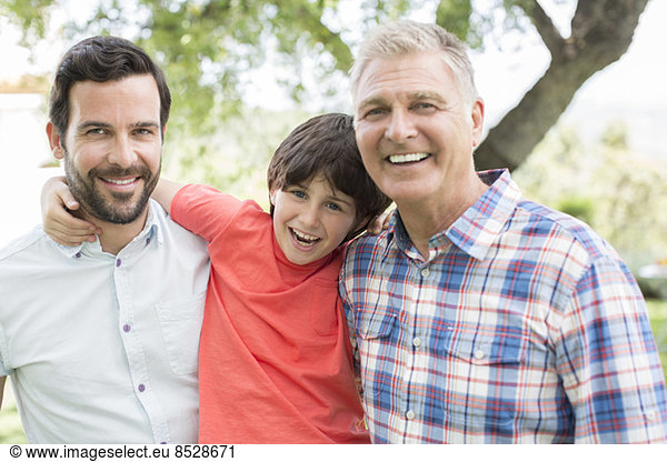 Multi-generation men smiling