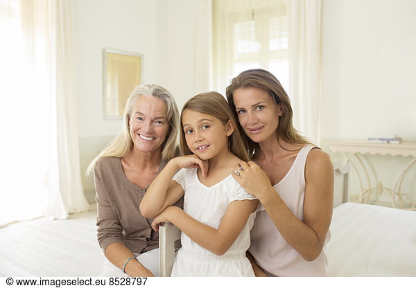 Multi-generation women in bedroom