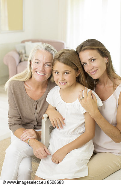 Multi-generation women smiling in bedroom