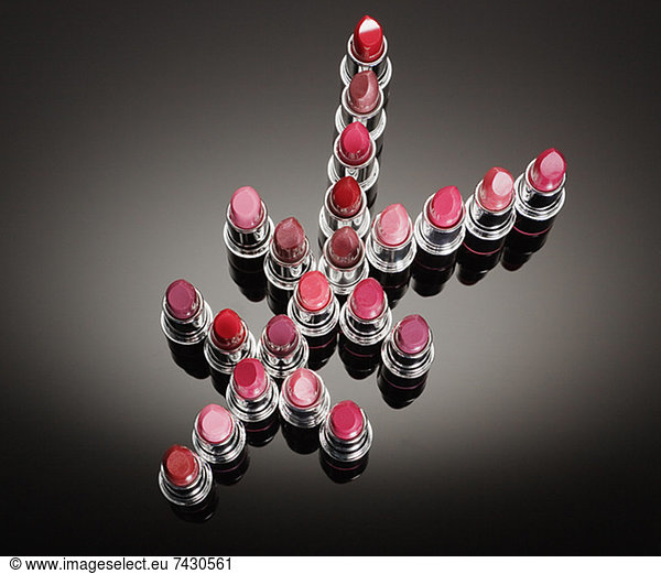 Multicolor lipsticks forming yen symbol