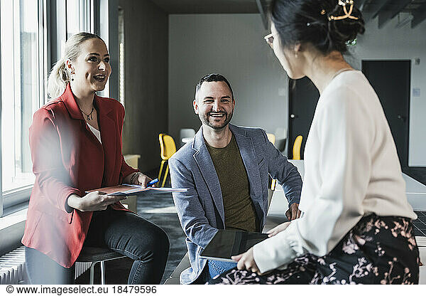 Multiracial business colleagues in meeting at workplace