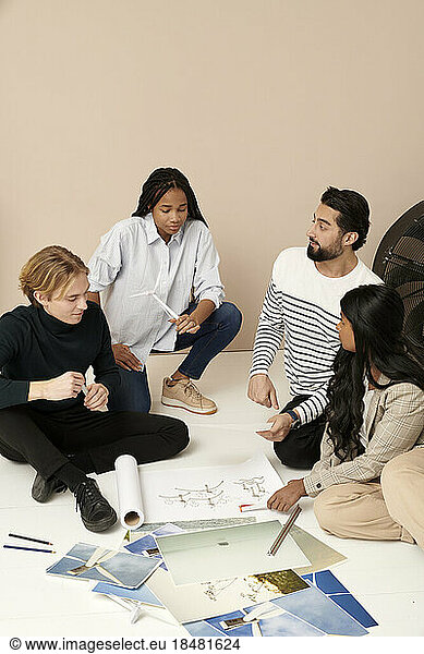 Multiracial business colleagues planning in meeting at office
