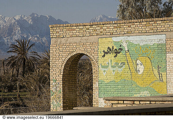 Mural of Iranian woman with a machine gun in Garmeh  Iran.
