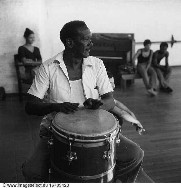 Music / Instruments:
Conga (Hand drum used in Latin American folk music). Drummer playing conga in the practice hall of the national ballet school Havanna (Cuba). Photo  1975.
From the series: École Nationale de Ballet .