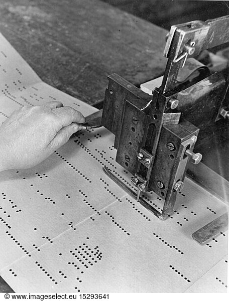 music  instruments  organ  stamping out sheet music for a mechanical organ  1950s  sheet music roll  score  roll  paper  papers  press  stamp  pressing  stamping  technics  machine  machines  industries  music industry  50s  20th century  people  hand  hands  stamp out  stamping out  stamped out  organ  organs  historic  historical
