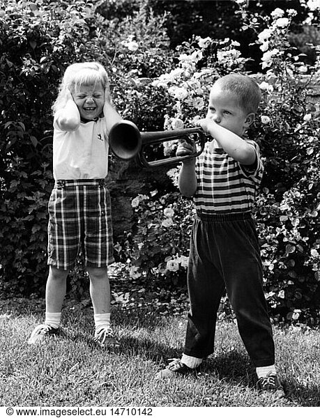 music  instruments  wind instruments  boy playing trumpet  1950s