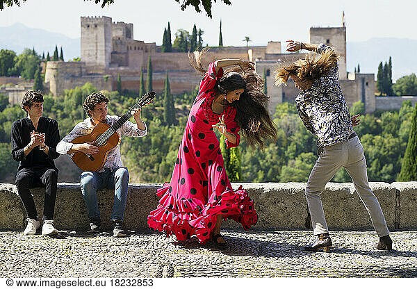 Musician and dancers performing flamenco at Alhambra  Granada  Spain