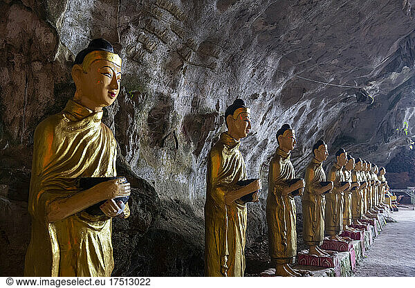 Myanmar  Kayin State  Hpa-an  Row of Buddha statues inside Saddan Cave