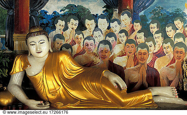 Myanmar  Mandalay  Reclining Buddha statue and paintings in Buddhist temple