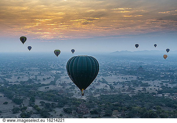 Myanmar  Mandalay Region  Bagan  Hot air balloons flying at foggy dawn