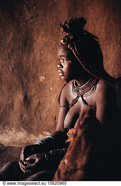 Namibia  Damaraland  portrait of Himba woman in her hut