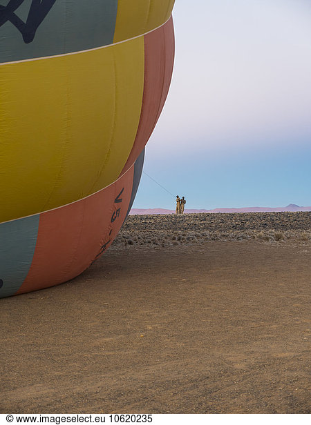 Namibia  Kuala Wilderness Reserve  Helpers holding air balloon before start
