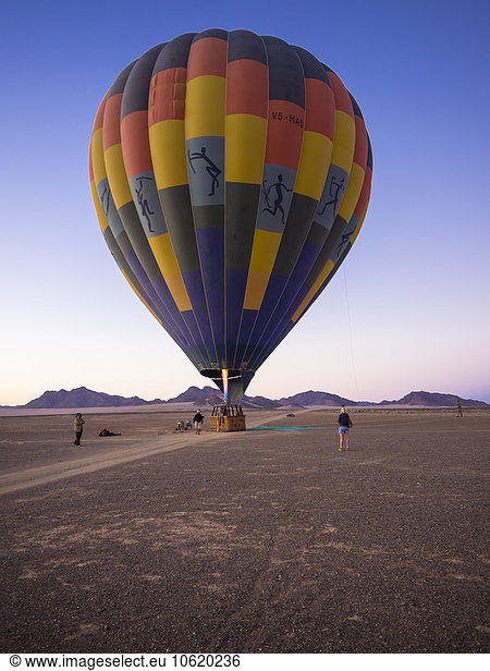 Namibia  Kuala Wilderness Reserve  People at air balloon at sunrise