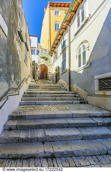 Narrow alley with stone stairs at Rovinj  Istria  Croatia