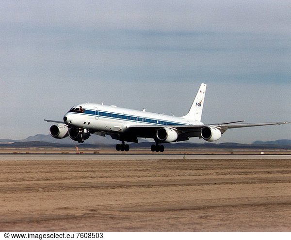 NASA´s DC_8 Airborne Science platform landing at Edwards Air Force Base  California  to join the fleet of aircraft at NASA´s Dryden Flight Research Center. The white aircraft with a blue stripe running horizontally from the nose to the tail is shown with its main landing gear just above the runway. The former airliner is a dash_72 model and has a range of 5 400 miles. The craft can stay airborne for 12 hours and has an operational speed range between 300 and 500 knots. The research flights are made at between 500 and 41 000 feet. The aircraft can carry up to 30 000 lbs of research/science payload equipment installed in 15 mission_definable spaces.