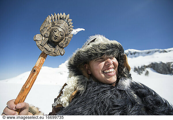 Native American hunter smiling wearing Traditional Fur clothing.