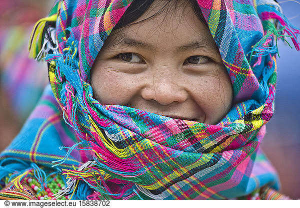 Native Hmong young girl wearing colorful clothes