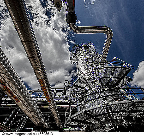 Natural gas plant structures against blue sky