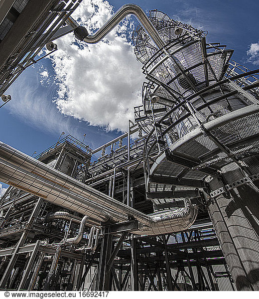 Natural gas processing plant structures with blue sky