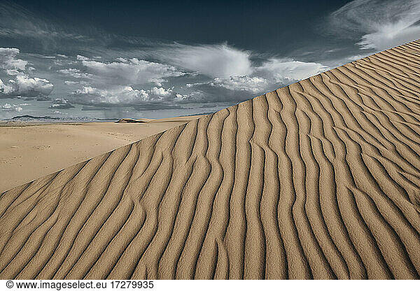 Natural wave pattern on Cadiz Dunes against sky at Mojave Desert  Southern California  USA