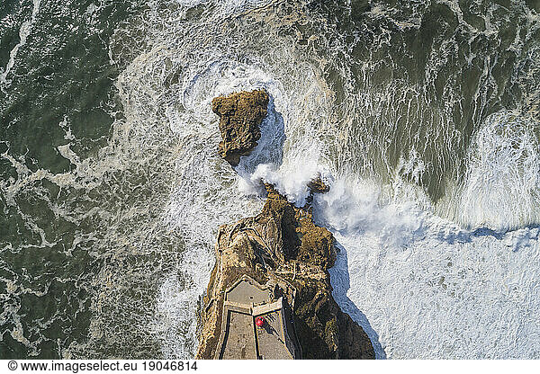 NazarÃ© Headlight from aerial view with enraged sea