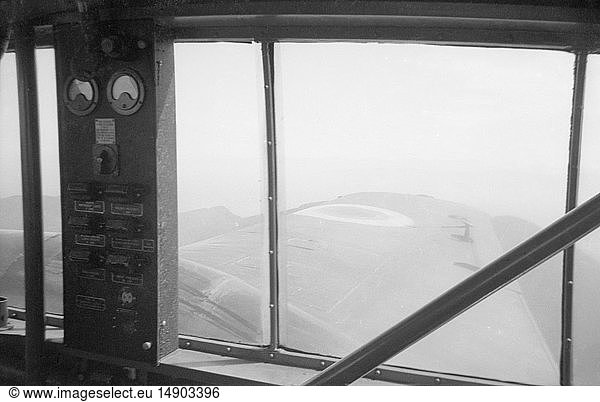 Negative early 20th century .Social History.The view throught the window of a 1930’a EAF aircraft looking along the wing