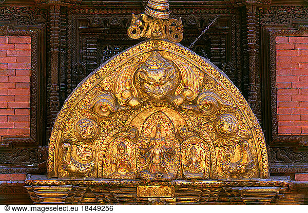 Nepal: A torana depicting the Hindu god Shiva’s family: a five-headed Shiva in the centre  with sons Ganesh and Kumar (Karttikeya) by their sides  Golden Gate (Sun Dhoka)  Royal Palace  Patan  Kathmandu Valley (1996)The Royal Palace supposedly dates back to the Licchavi period (5th-13th century)  but  with the exception of a few inscriptions  there is little substantial evidence for this. In the earliest inscription  which hails from the year 643 CE and which was found at the Keshav Narayan Chowk  Licchavi King Narendra Deva announced the abolition of three types of taxes  presumably making him popular with his subjects. This indicates that there may at the time have been a palace at the site of Keshav Narayan Chowk  which is part of the present royal palace complex.The royal palace as seen today in Durbar Square has its origins in the 14th century; however  the most active building period was the 17th century. Pictures From Asia Rainer Krack