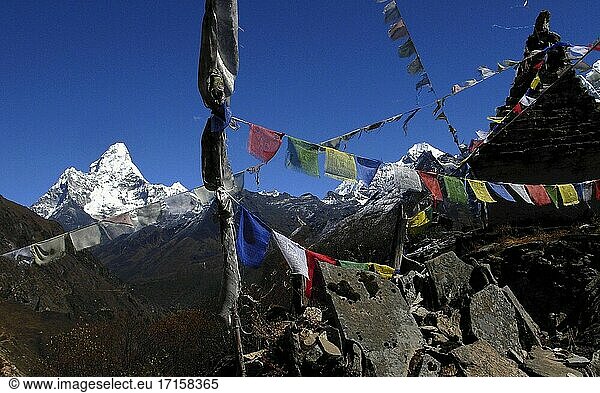 NEPAL Mong La -- Buddhist Mani stones with Mount Ama Dablam in the background.