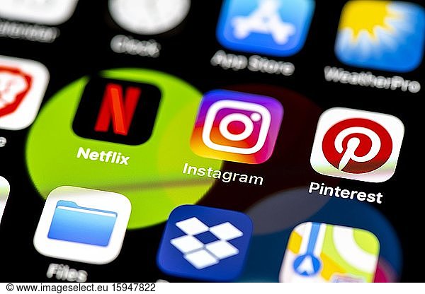 Netflix  Instagram  Pinterest  App Icons on a mobile phone display  iPhone  Smartphone  close-up